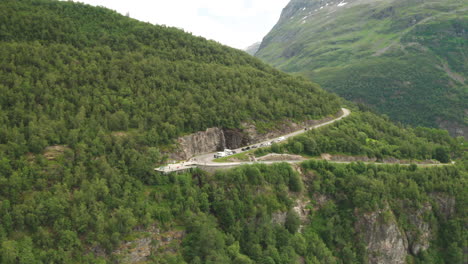 vehicles and people at the scenic viewing platform on hillside