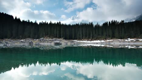 lago di carezza in south tyrol, italy - 4k mountain lake time-lapse in the dolomites