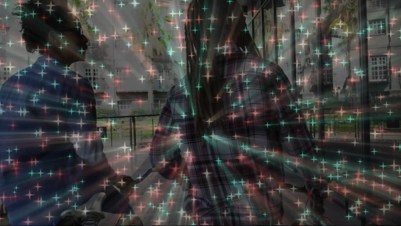 Two male friends holding bike handles near walkway, showing green red starburst in tech marketing