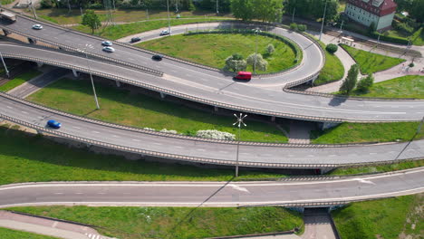 top-down-aerial---A-flyover,-a-multi-drug-intersection,-multi-level-traffic-in-the-city