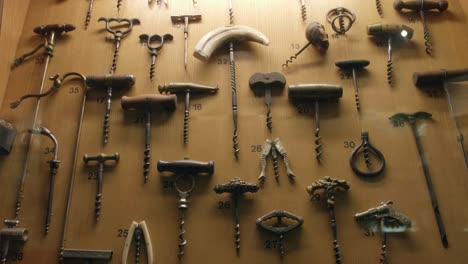 old wine bottle corkscrews in a museum