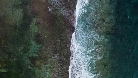 bird's eye view of indian ocean waves crushing on rocks in middle of ocean amazing drone rare footage filmed in 6k downsized to 4k