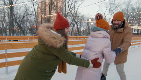 family ice skating fun in the park