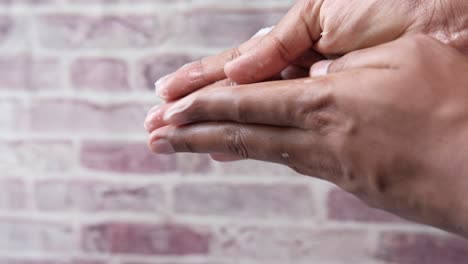 hands applying cream or lotion