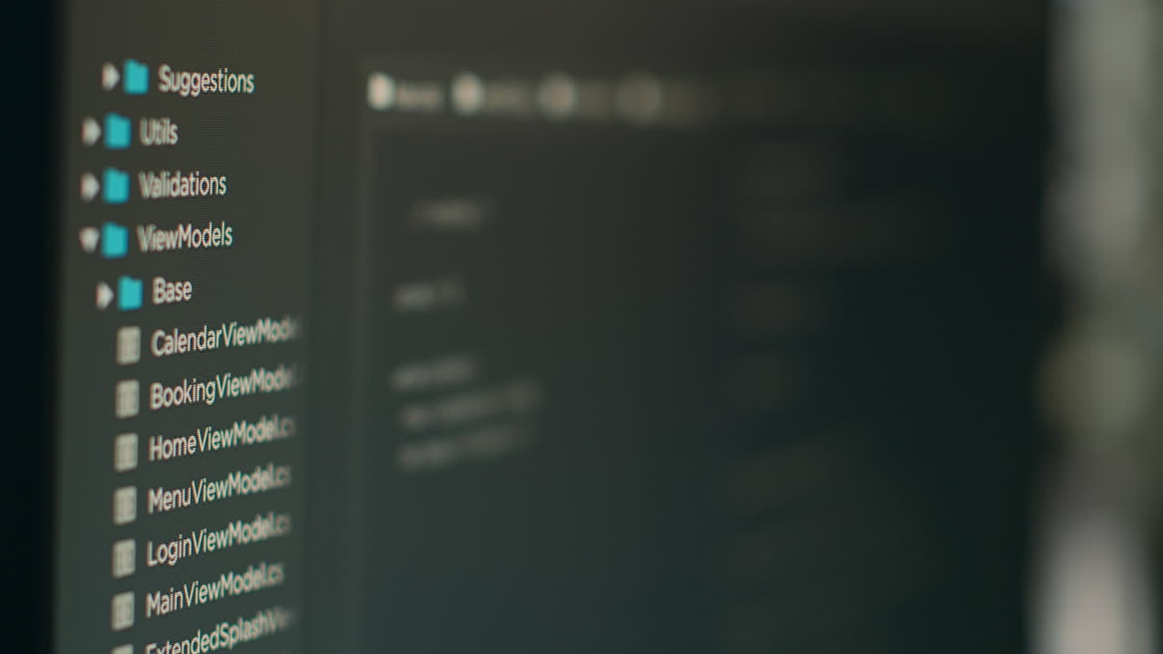 Computer display of software developer typing database functions script on terminal window