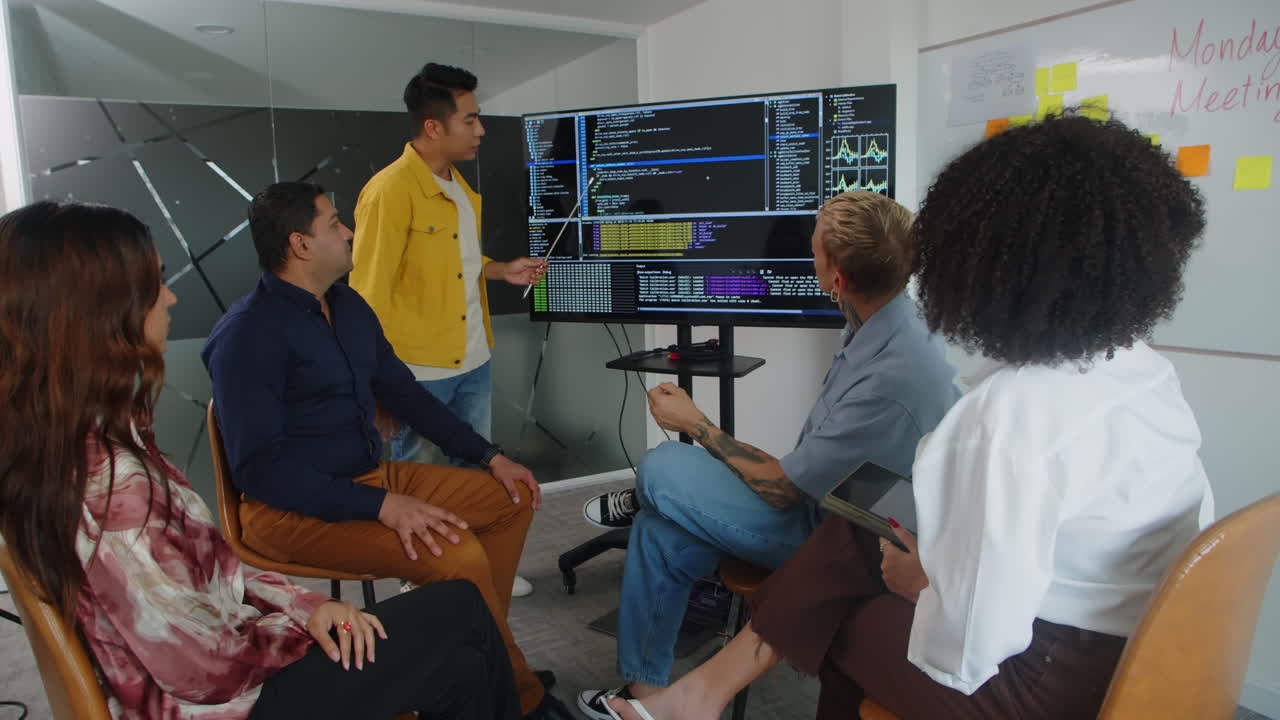 Young Businessman Presenting Project during Meeting