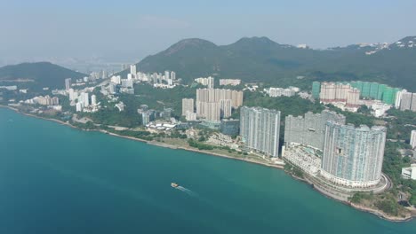 Hong-Kong-Cyberport-waterfront-park-luxury-residential-buildings,-Aerial-view