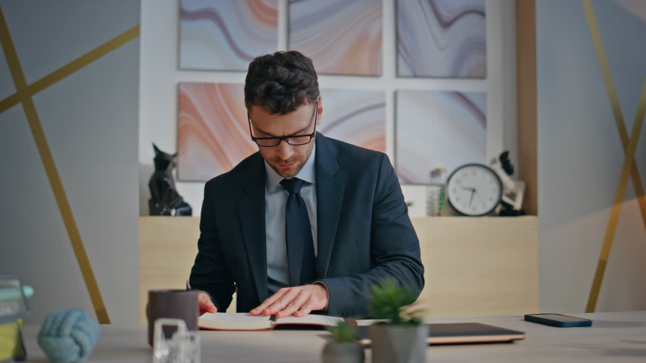 Morning businessman taking notebook starting work day at creative agency closeup