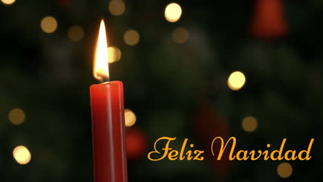 feliz navidad escrito sobre una vela encendida
