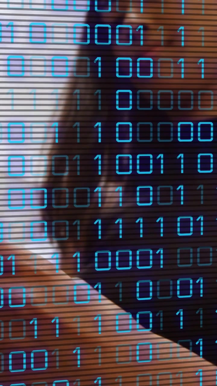 Vertical video: Woman holding phone near face shifting grip while binary scanline showing tech data