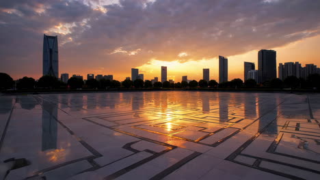 dramatic city skyline reflection at sunset