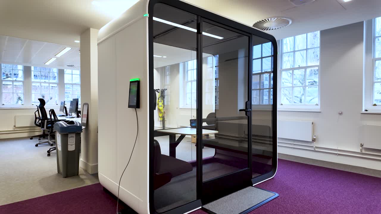 Soundproof acoustic pod designed for focus and privacy in a modern office environment