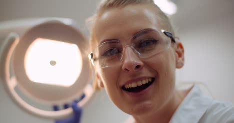 Young-Positive-Female-Dentist-Smiling-At-Dental-Clinic-4