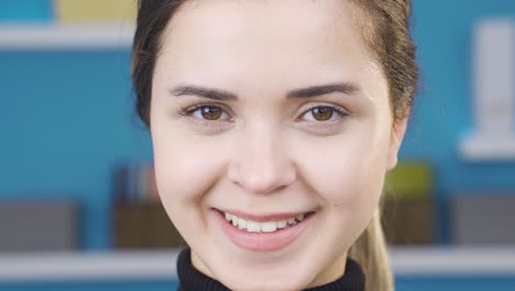 Close-up-portrait-of-positive-and-cheerful-young-woman.