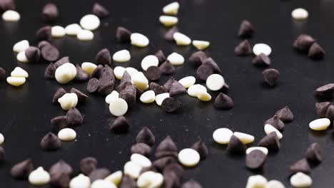 white and dark chocolate chips scatter on surface