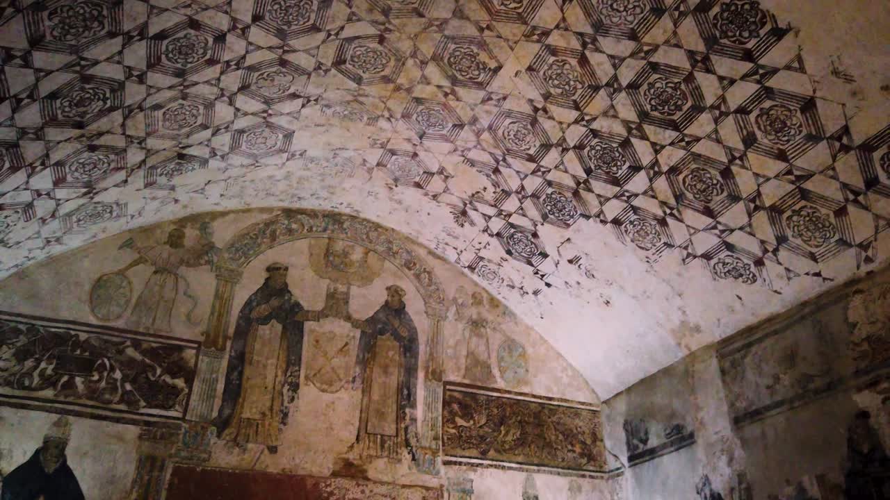 Panoramic detailed shot of mural paintings on the altarpiece wall and single nave interior of the ex-convent in Tepoztlán, Mexico
