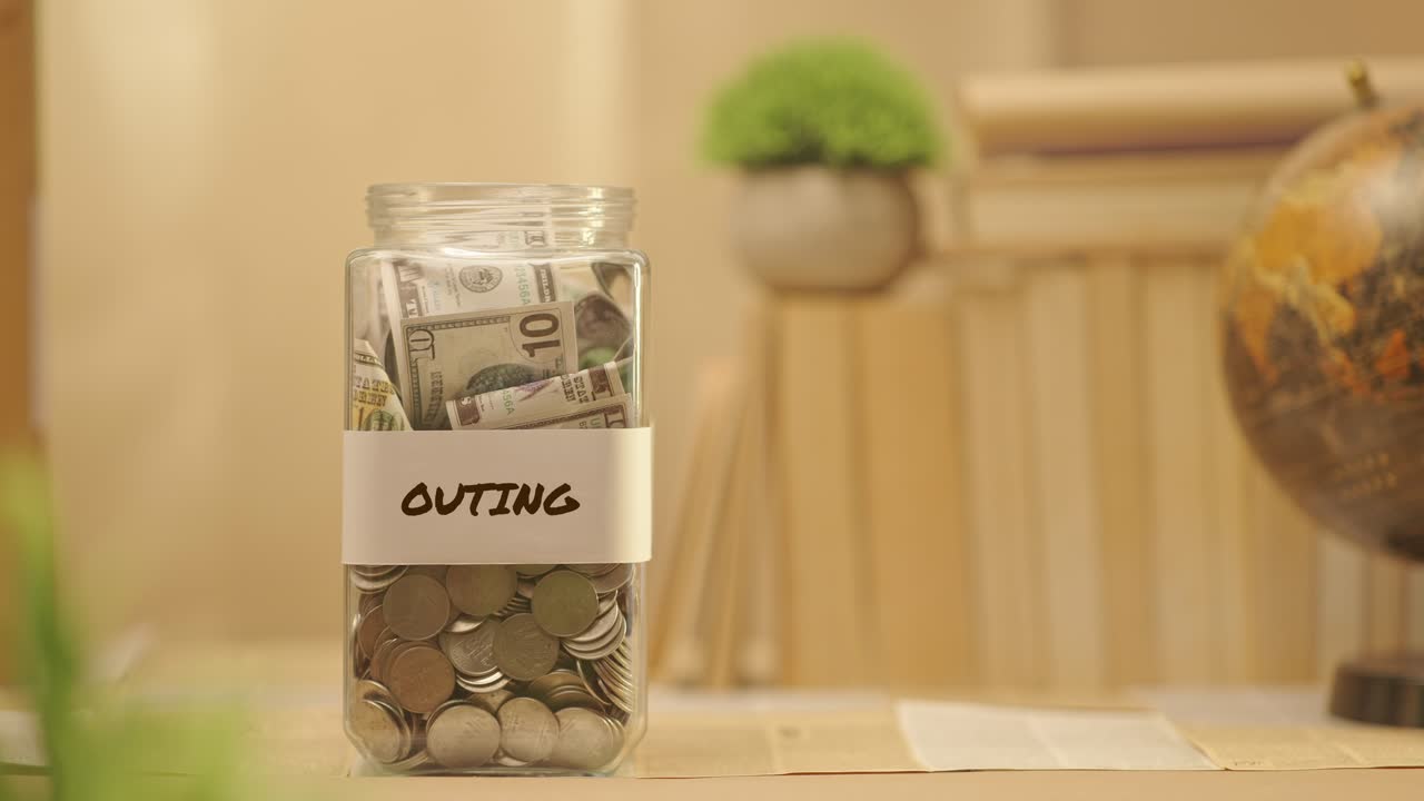 PERSON SAVING MONEY FOR OUTING