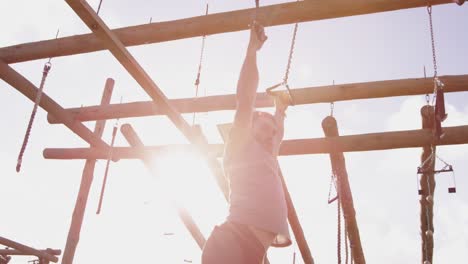 young man training at an outdoor gym bootcamp