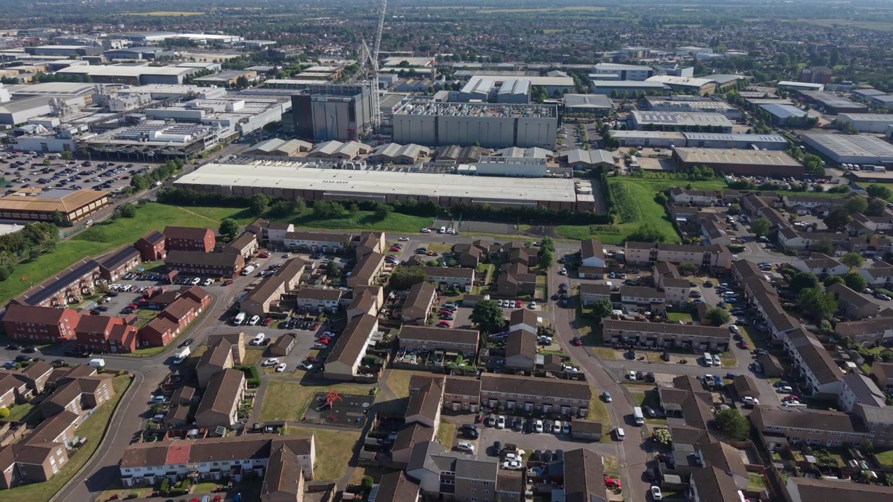 High altitude view of a massive data center complex undergoing construction.
