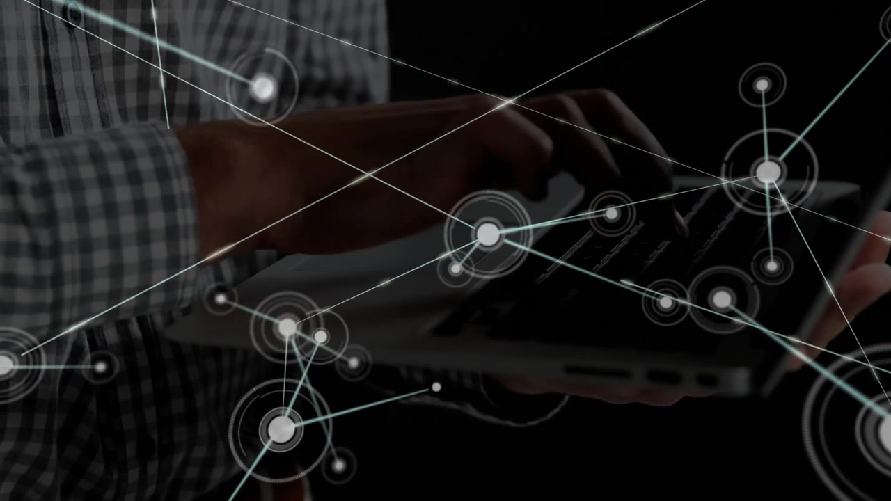Technology user typing laptop initiating interface and growing network nodes mapping connectivity