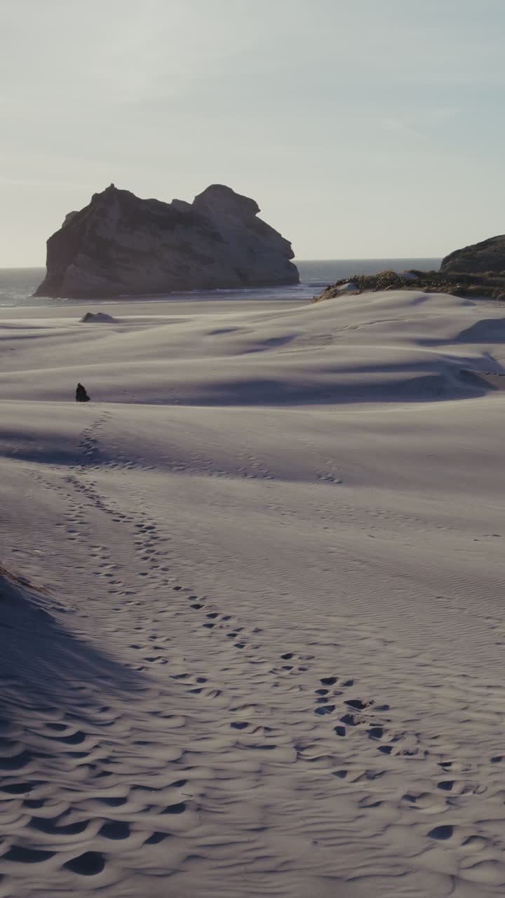 Empty Beach with Footprints on Sand Dunes