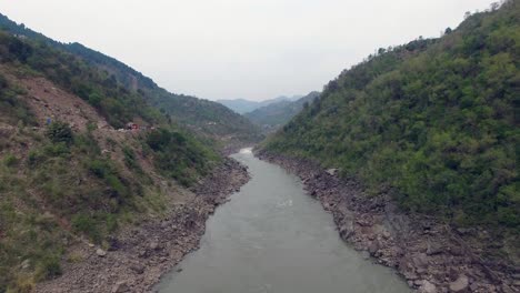 A-river-in-mountains-with-a-road