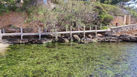 cala de n'pina is a beautiful cove with a perfect seabed for snorkeling.in mallorca