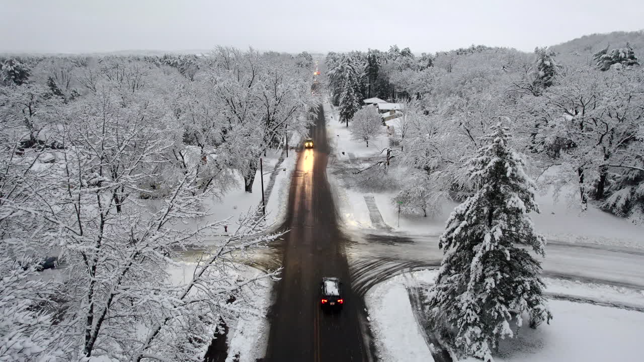 Snowy Road with Cars at Intersection