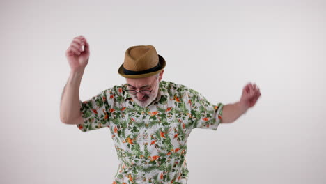man in hawaiian shirt and hat dancing