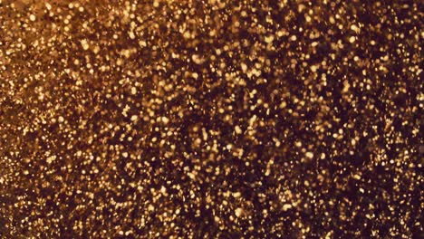 abstract golden particles with blurred defocused bokeh moves chaos, snow flakes