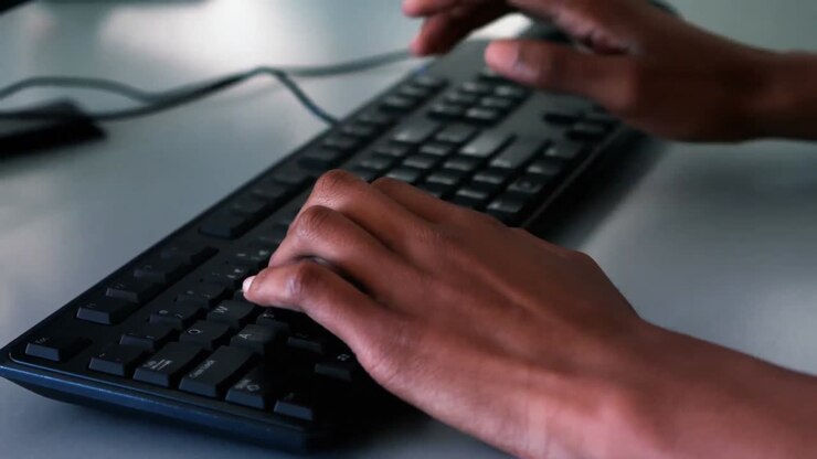 Student studying on computer in classroom