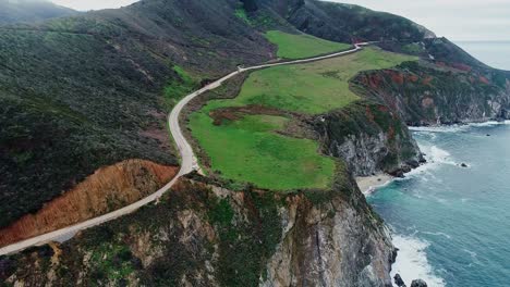 coastal road winding along steep cliffs on the way from san francisco to la