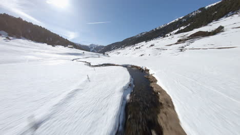 creek flowing in snowy incles valley, andorra