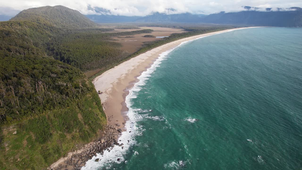Pristine Beach With Dense Forest On Bruce Bay On Tasman Coast In New Zealand. aerial shot