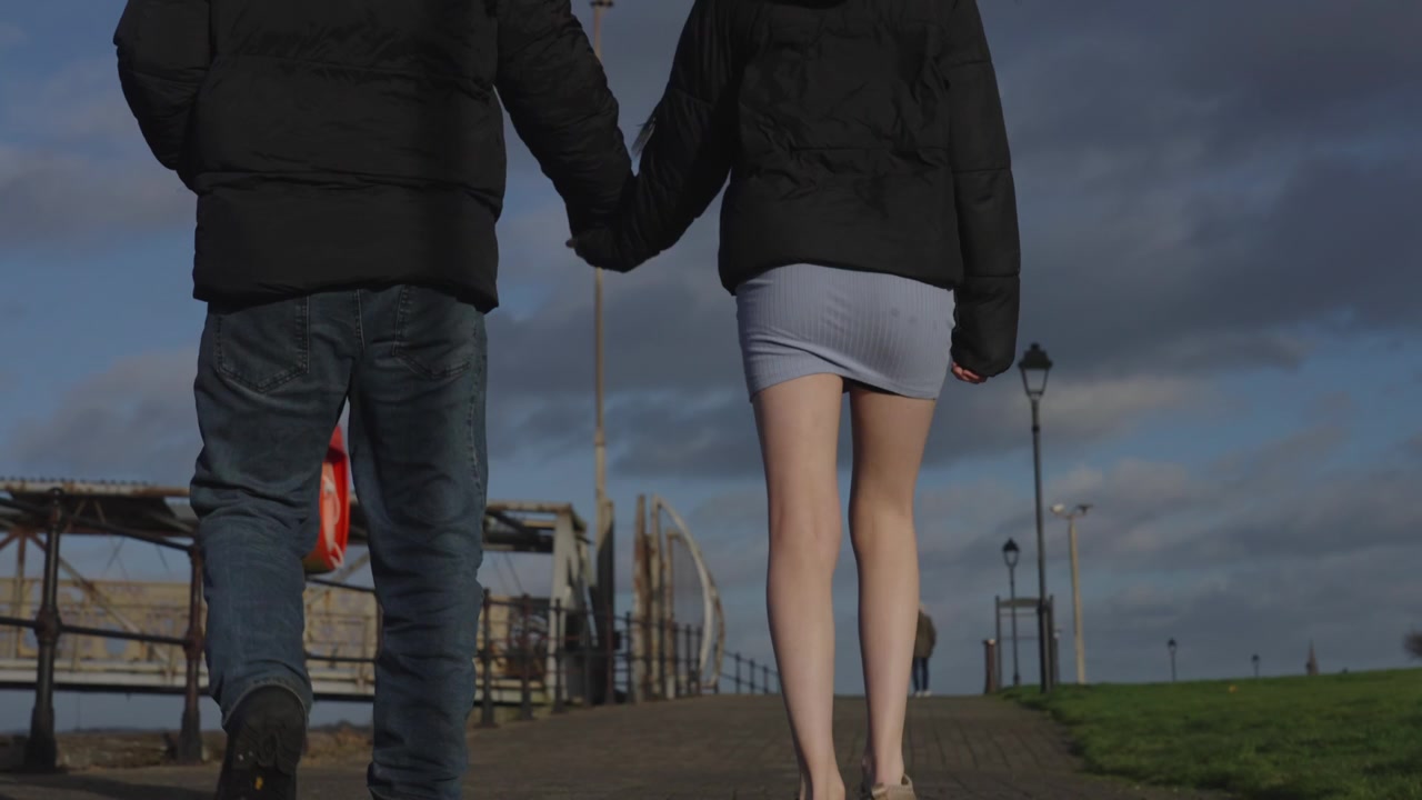 Couples romantic date, seaside promenade, cold weather exercise