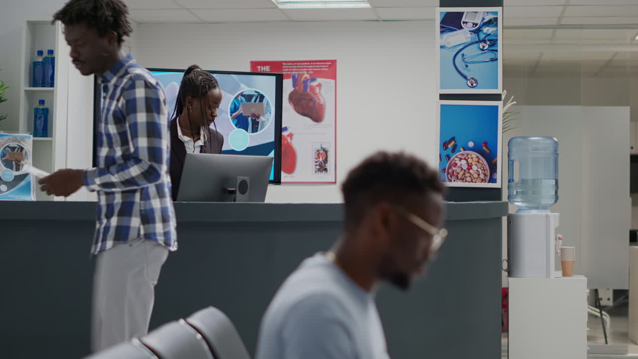 Professional medic giving advice to sick patient in facility hallway