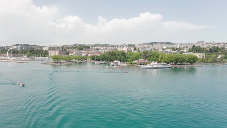 jib down of skyline of the city of lausanne, switzerland seen from lake geneva