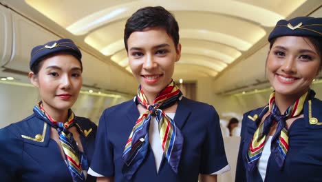 group of cabin crew or air hostess in airplane