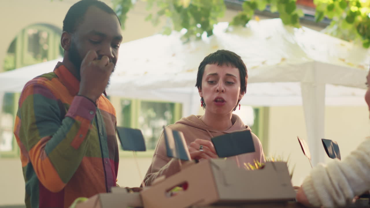 People Tasting Apples at a Market