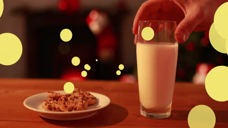 animación de puntos moviéndose sobre leche y galletas para papá noel.