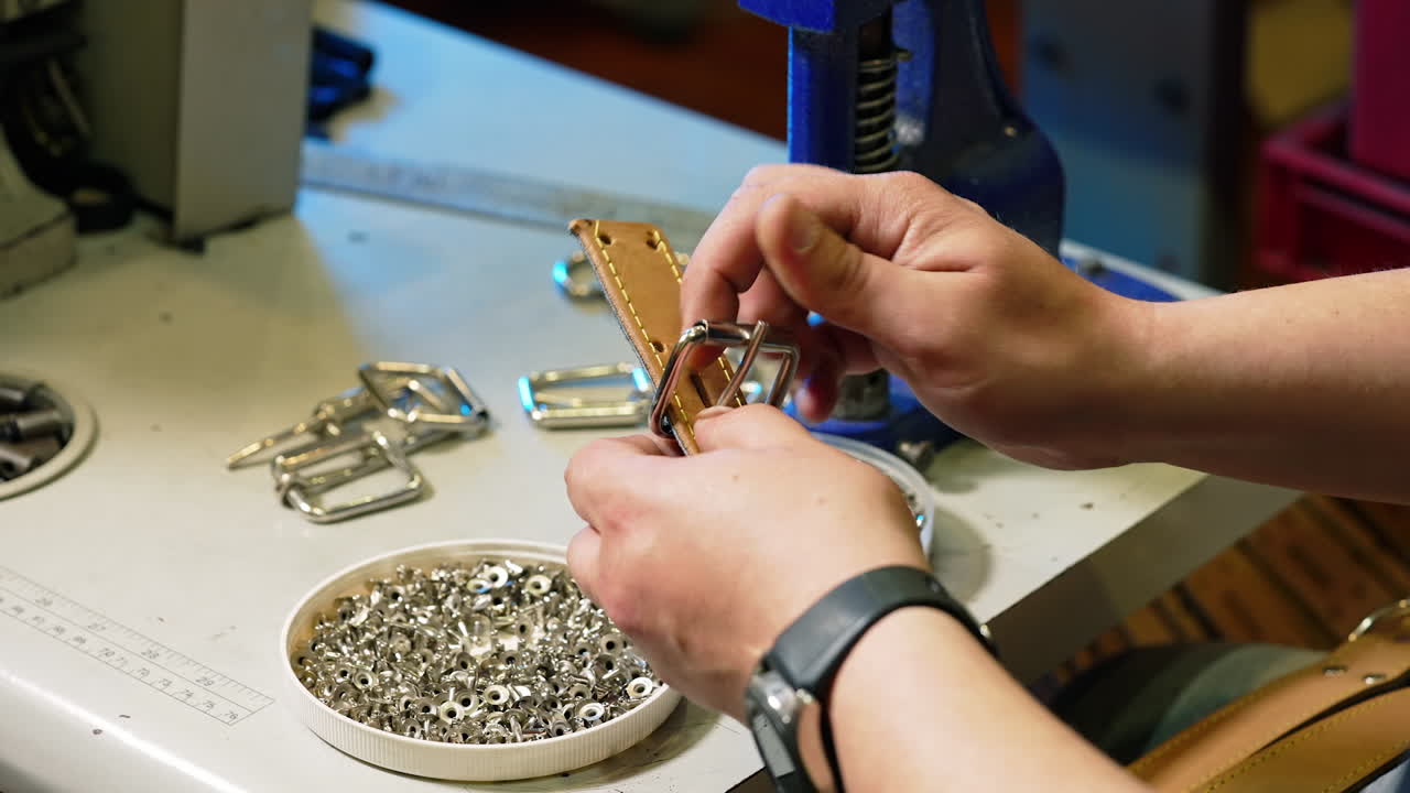 Tailor hands at work in fabric