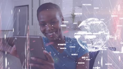 animation of network of digital icons and spinning globe over woman using tablet