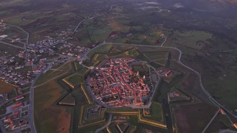 Aerial-view-of-Star-Fortress-Almeida-Portugal-during-sunrise,-drone-shot