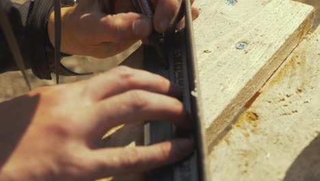 marking angle iron for drilling holes to build fencing