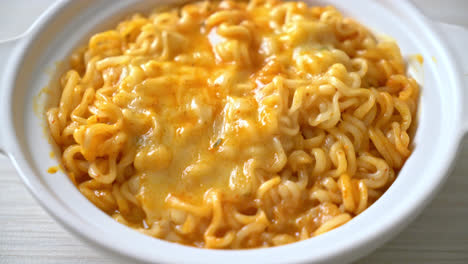 spicy instant noodle bowl with mozzarella cheese