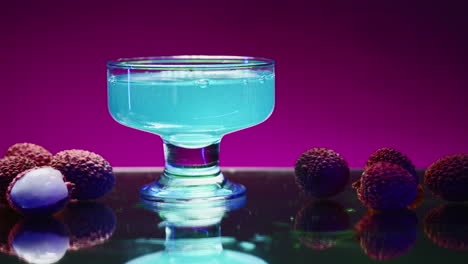 vibrant blue lychee juice in a glass