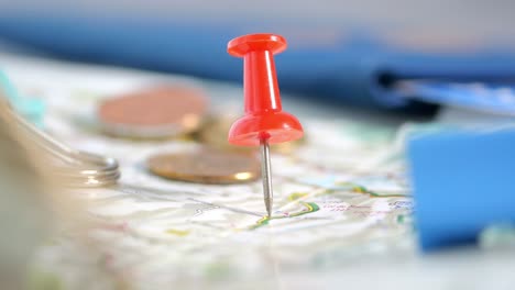 red pushpin on a map
