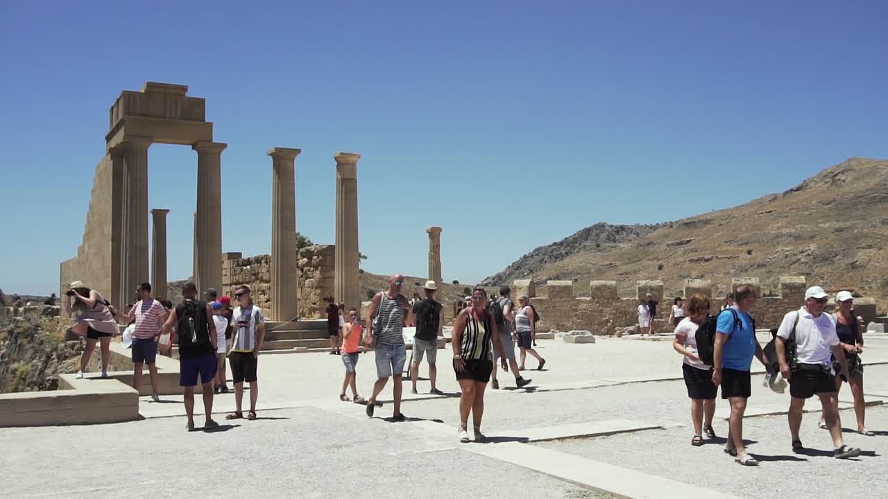 Tourists Exploring Ancient Ruins in Greece