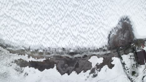 Aerial-view-of-intricate-frost-patterns-on-a-Polish-lake-surface-near-Suwałki