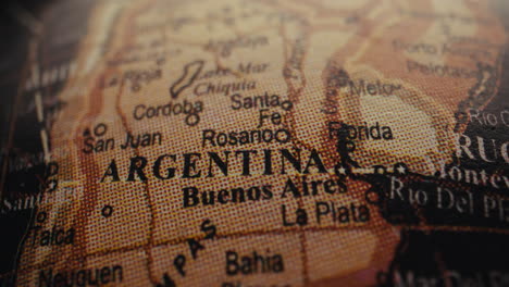 close-up of a vintage world map focusing on argentina